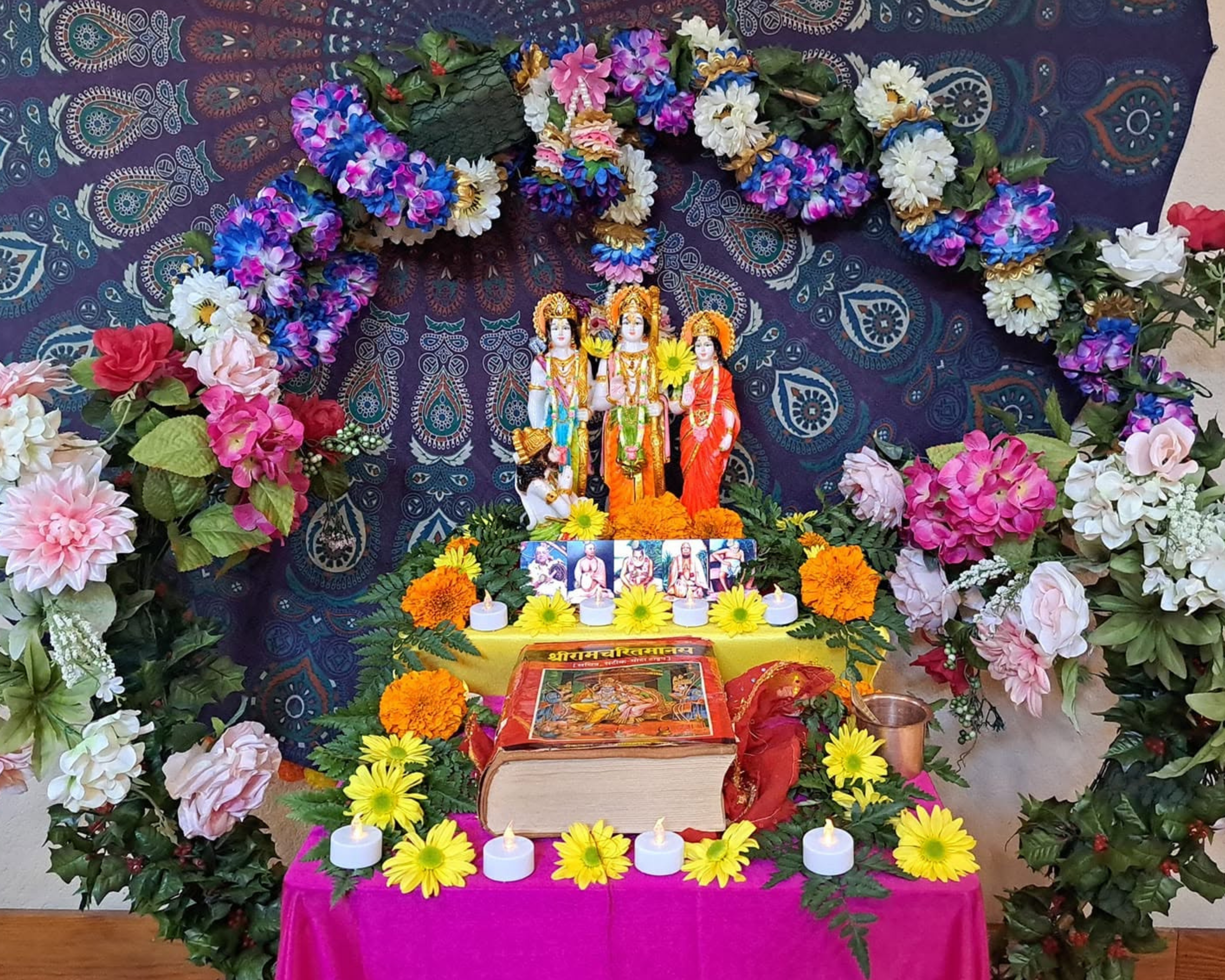 Deity worship altar adorned with flowers at ISKCON Cedar Park
