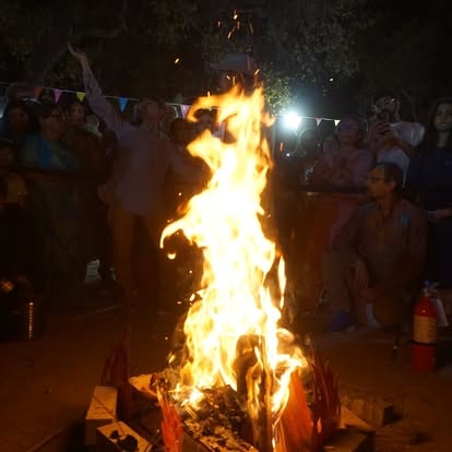 Holika Dahan bonfire gathering at night at ISKCON Cedar Park