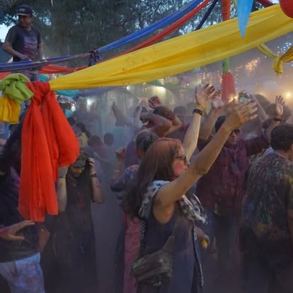 Holi festival celebration with powder clouds at ISKCON Cedar Park