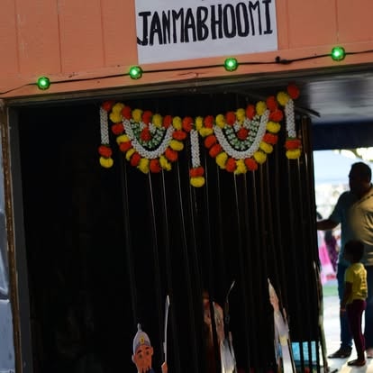 Shop entrance decorated with colorful flower garlands at ISKCON Cedar Park