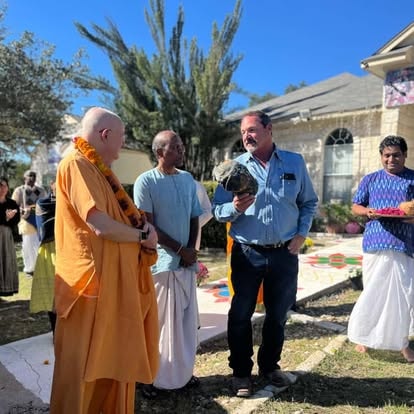 Swami and officials speaking at outdoor festival event at ISKCON Cedar Park