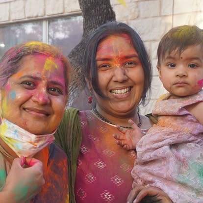 Women and child celebrating Holi at ISKCON Cedar Park
