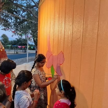 Children painting at community event at ISKCON Cedar Park