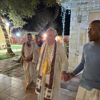 People gathering at festive outdoor evening celebration at ISKCON Cedar Park