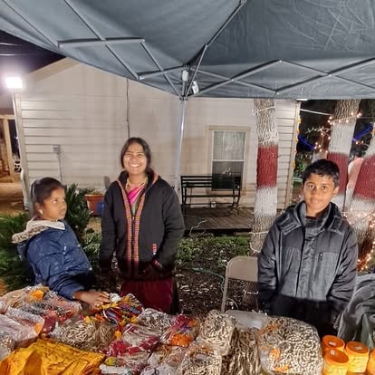 Family selling food at night market festival